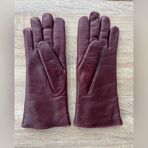 COACH Leather gloves in deep red. Lightly used, good shape. 100% shearling …